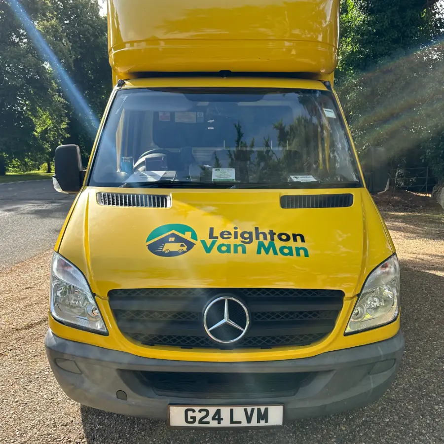 Front of the Removals Leighton Buzzard van with the logo above the cab